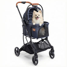 A fluffy light-colored dog sits comfortably in the Pawbella Essential Pet Stroller—lightweight, for small dogs & cats (up to 20kg)—with mesh window and tan handle, against a plain white background.