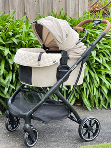 Side view of the Pawbella Ultimate Pet Stroller with beige plush cushion set
